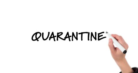 Hand writing 'quarantine' on white background with black marker