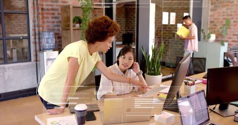 Diverse Business Team Collaborating with Financial Data in Modern Office