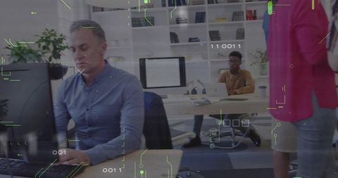 Mature man working at desk in modern office setting