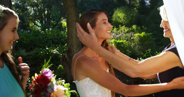 Joyful Bride Greeting Family Members at Outdoor Wedding - Download Free Stock Images Pikwizard.com