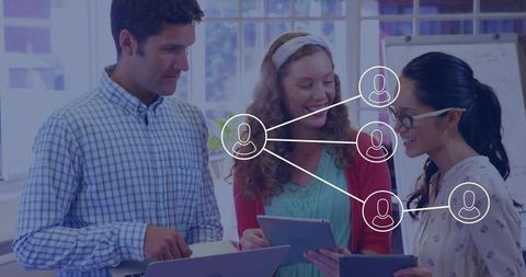 Professionals Collaborating with Technology in Modern Office