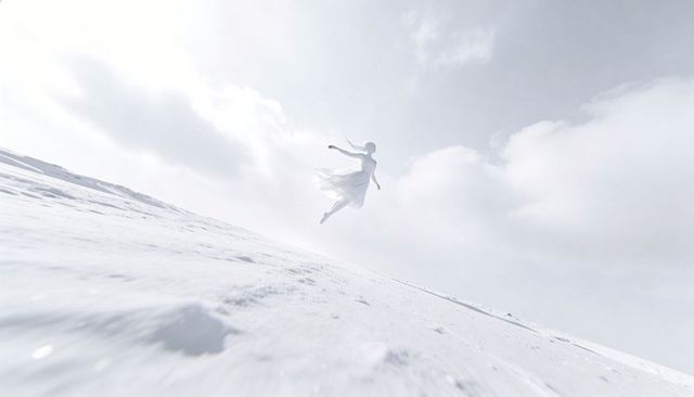 Ethereal woman leaping and floating above snowy slope in flowing white dress, cloudy sky