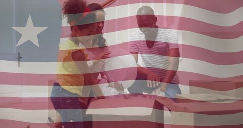 Family Unpacking Belongings Together at Home