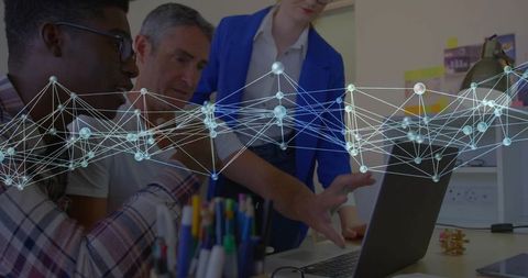 Team collaborating and analyzing network data on laptop with digital connection overlay