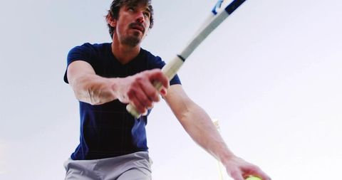 Focused Tennis Player Ready to Serve with Determination