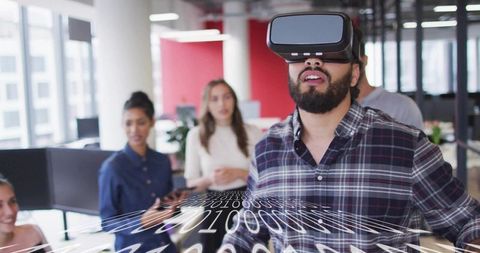 Man Wearing VR Headset Experiencing Virtual Reality in Modern Office