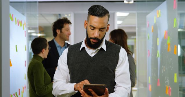 Business Professional Using Tablet in Creative Office Environment - Download Free Stock Images Pikwizard.com