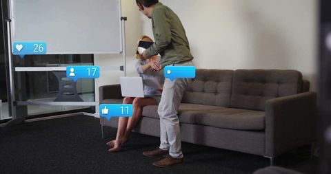 Colleagues Networking with Social Media Interaction in Office Lounge