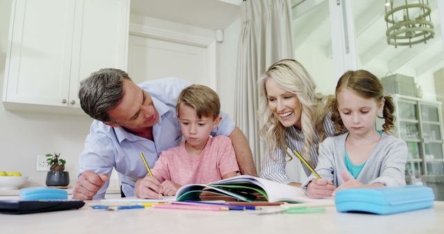 Happy Family Doing Homework Together at Kitchen Table - Download Free Stock Images Pikwizard.com