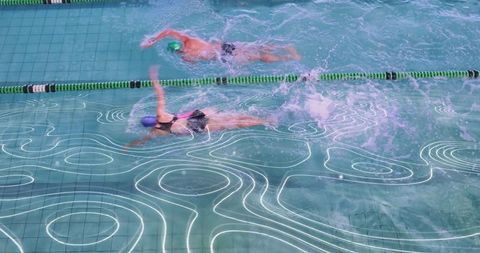 Competitive swim training race in aquatic lap pool