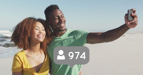Couple enjoying beach selfie with social media elements