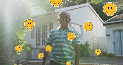 Joyful African American Boy Outdoor with Overlay of Smiley Faces