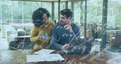 Mathematical Equations Over Couple Using Laptop in Home Office