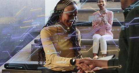 Shaking Hands Over Tablet Exchanging Wearable Tech with Futuristic Augmented Reality Overlays