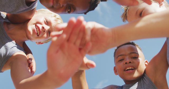 Image of happy diverse boys holding arms and clapping hands - Download Free Stock Photos Pikwizard.com