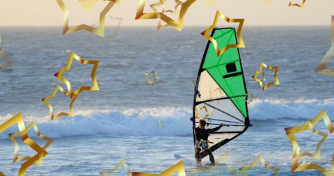 Caucasian Windsurfer Surging Through Ocean With Star Effects