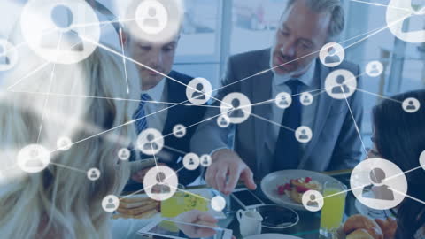 Connected Business Professionals Discussing Over Office Table