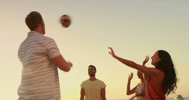 Friends Having Fun Playing Beach Volleyball at Sunset - Download Free Stock Images Pikwizard.com