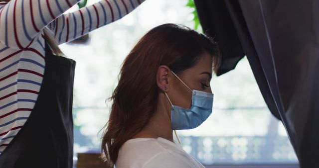 Hairdresser Styling Client's Hair While Wearing Protective Mask, Salon Safety - Download Free Stock Images Pikwizard.com