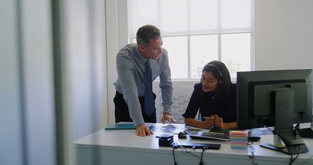 Manager Discussing Work with Young Female Employee in Modern Office - Download Free Stock Images Pikwizard.com