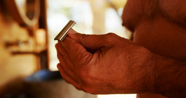 Man Holding Razor While Preparing to Shave in Morning Light - Download Free Stock Images Pikwizard.com