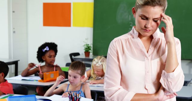 Frustrated Teacher in Classroom with Elementary Students - Download Free Stock Images Pikwizard.com