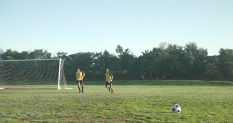 Athletes Running on Soccer Field for Practice Session