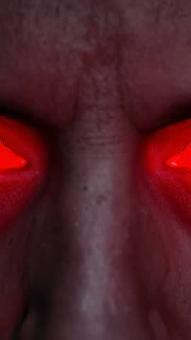 Vertical Close-Up Video Showing Red Glowing Eyes Staring from Dark Void