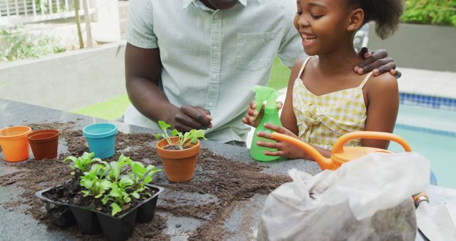 Father bonding with daughter while gardening in backyard. Perfect for family-related themes, outdoor activities, parenting, home gardening, and raising kids. Ideal for websites, blogs, advertisements focused on family fun, environmental awareness, and DIY gardening projects.