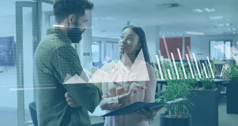 Diverse Colleagues Collaborating with Digital Charts in Office