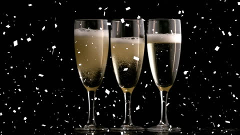 Sparkling Celebration with Falling Confetti and Champagne Flutes