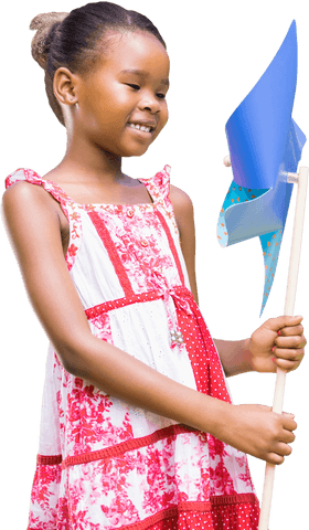 Joyful child with pinwheel celebrating outdoors - transparent