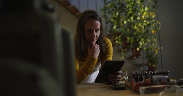 Woman Handcrafting with Digital Tablet in Cozy Workshop - Download Free Stock Images Pikwizard.com