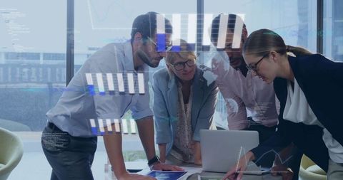 Focused Team Analyzing Data Charts in Modern Office