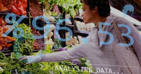 Woman selecting fresh greens in supermarket with data overlay for retail analytics