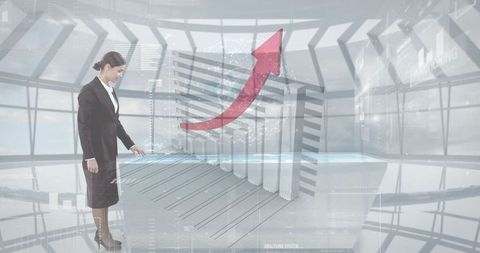 Businesswoman analyzing 3d bar chart hologram in futuristic office
