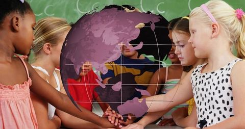 Children stacking hands under floating globe teaching global unity and teamwork