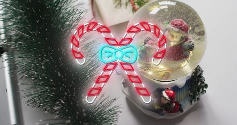 Neon Candy Canes with Christmas Decorations and Snow Globe