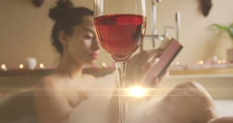 Relaxed Woman Enjoying Wine and Book in Cozy Bathtub - Download Free Stock Images Pikwizard.com