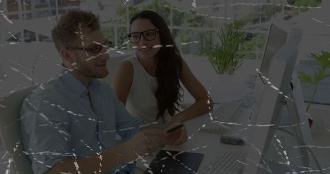 Professional colleagues collaborating in modern high-tech office