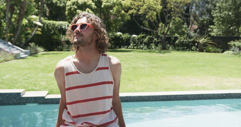 Sun-Kissed Young Man by Pool Enjoying Leisure Time - Download Free Stock Images Pikwizard.com