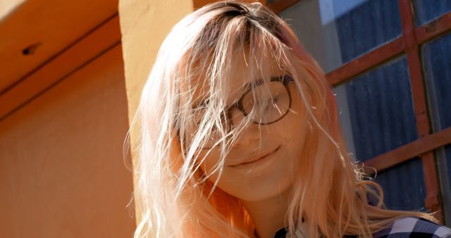 Young Woman with Pink Hair and Glasses Smiling in Sunlight - Download Free Stock Images Pikwizard.com