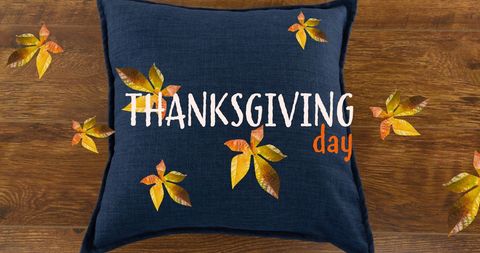 Thanksgiving Day Text with Autumn Leaves on Blue Pillow