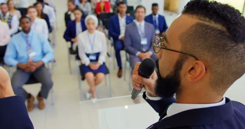 Male speaker giving inspirational business seminar