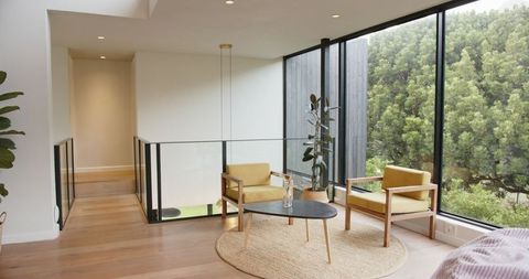 Modern Living Space with Stylish Armchairs and Large Windows
