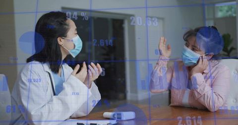 Doctor Conducting Home Visit Consultation With Masked Patient and Data Charts Overlay