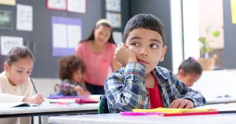 Daydreaming Boy in Diverse Classroom - Download Free Stock Images Pikwizard.com