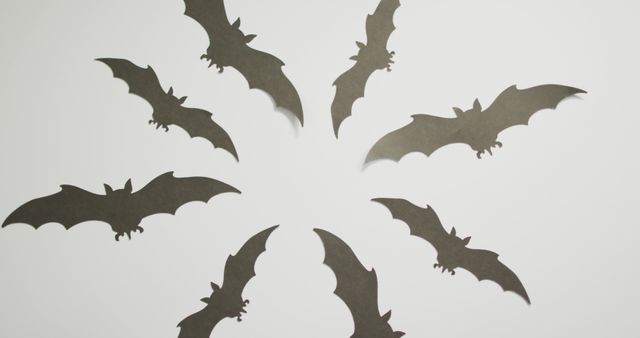 Digital image of multiple halloween bat icons against grey background. halloween holiday and celebration concept