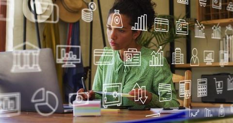 Focused Woman Analyzing Financial Data with Infographic Overlay