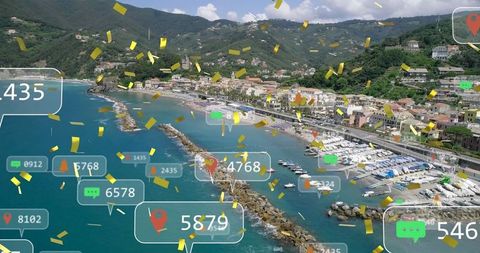Celebratory social media icons over picturesque coastal town